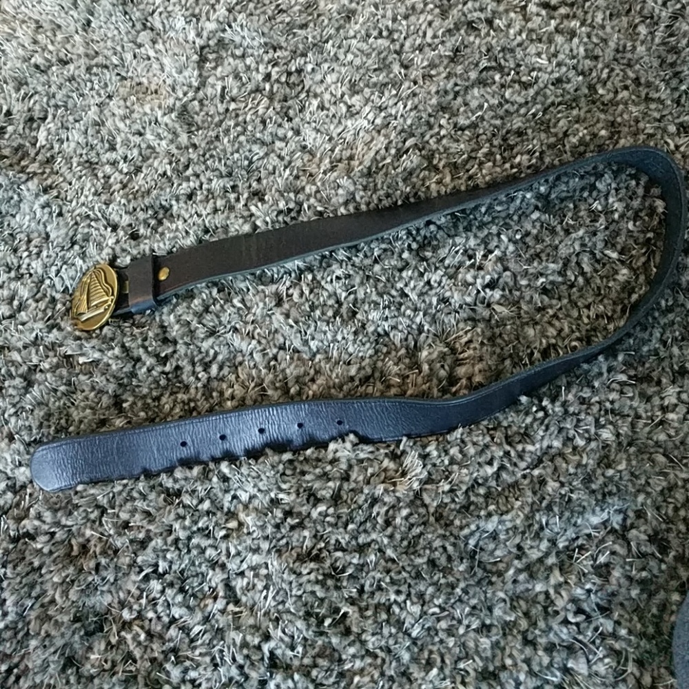 Navy leather belt with gold sailboat buckle